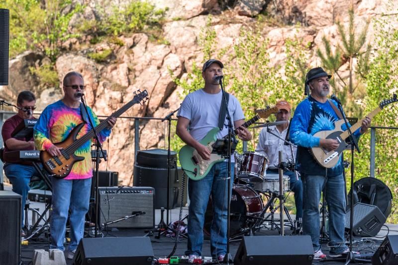 A group shot of Filthy Rich and the Empty Pockets performing at The Stockey Centre